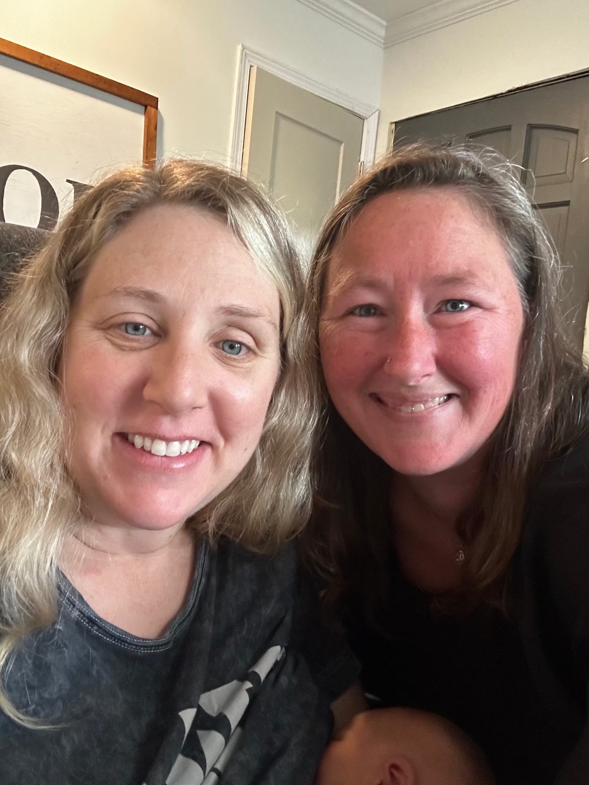 Kristie and Sarah Jane’s mom smiling cheek to cheek